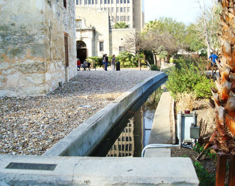 Part of what remains of the Acequia Madre de Valero behind the Alamo church. Photo by author.